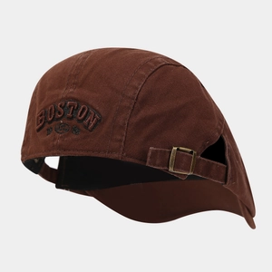 Detail view of the vintage brown cotton cap showing the copper metal buckle and embroidery