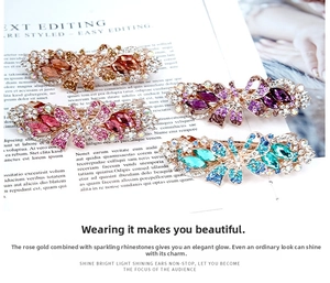 Detailed set of four rose gold alloy hair clips featuring colorful marquise crystals