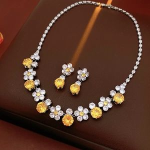 Exquisite flower jewelry set with yellow zircon necklace and earrings on leather