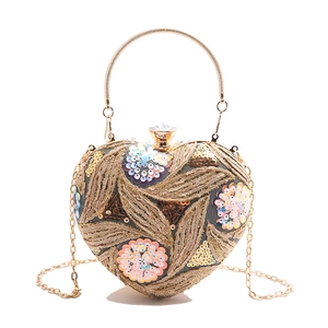 Golden heart-shaped evening clutch bag with sequin embroidery and chain strap