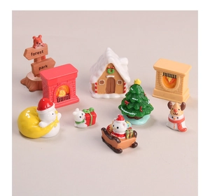 Detailed resin Christmas miniature set featuring snowman gingerbread house and festive decor