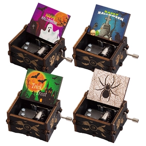 Set of four wooden hand-crank Halloween music boxes with classic spooky illustrations