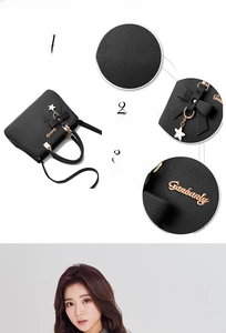 Detail of black lychee grain PU leather bag with golden star bow charm and logo