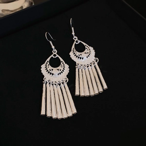 Vintage ethnic wind chime drop earrings with silver metallic tassels and hollow patterns