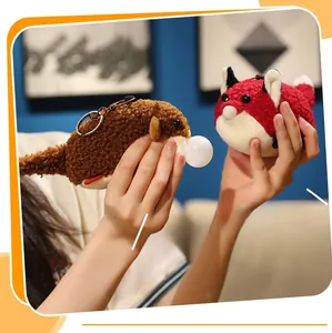 Detail of plush otter and fox squeeze toys with bubble feature and metal keychains
