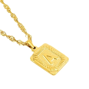 Gold rectangular pendant necklace with engraved letter A and radiant sunbeam texture
