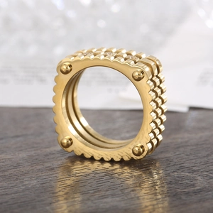 Luxurious gold stainless steel square rivet ring with layered gear design for a bold look