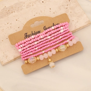 Bohemian multilayer beaded bracelet set with pink and white beads on jewelry card