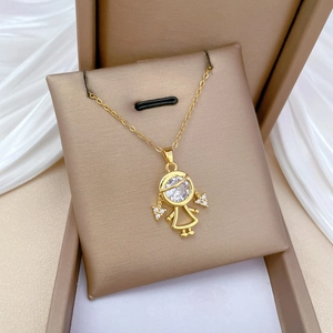 Macro detail of gold-plated girl pendant with sparkling pavé cubic zirconia inlay