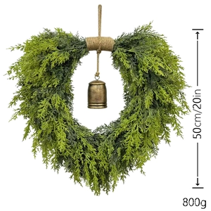 Detailed 50cm heart-shaped green cedar wreath with rustic bronze bell and twine hanger