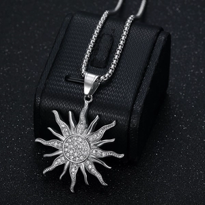 Iced out silver sunflower pendant necklace with sparkling crystals on a box chain