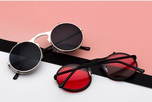 Dual layer steampunk flip-up sunglasses with round metal frames in gold and black colors
