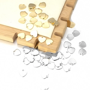 Polished stainless steel heart-shaped pendants in gold and silver finish for DIY jewelry