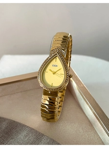 Detailed view of teardrop shaped luxury gold watch with sparkling crystals and snake band
