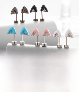 Detailed view of titanium steel cat ear stud with zircon and color oil dripping finish