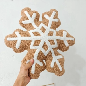 Brown plush snowflake pillow with cozy teddy velvet texture for Christmas home decor