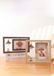 Macro view of rotating double-sided wooden photo frames in dark brown and natural finishes