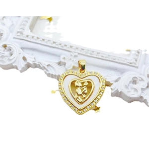 Gold plated heart pendant with zircon accents featuring mother and child design