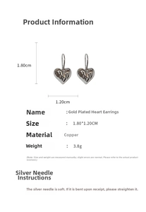Macro shot of silver plated heart drop earrings showing 1.80cm by 1.20cm size dimensions