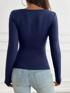 Rear view of a slim fit navy long sleeve T-shirt showing fabric texture and tailoring