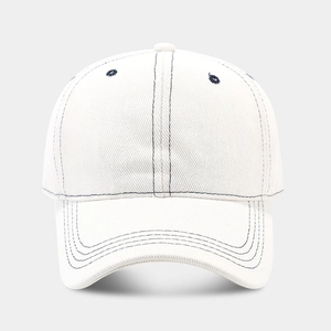 Front view of white cotton baseball cap with dark blue contrast stitching and curved brim