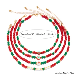 Detailed view of Christmas choker necklaces with Hoho beads and holiday charms