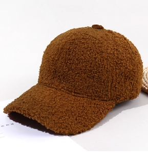 Detailed view of caramel brown teddy fleece baseball cap with thick wool texture