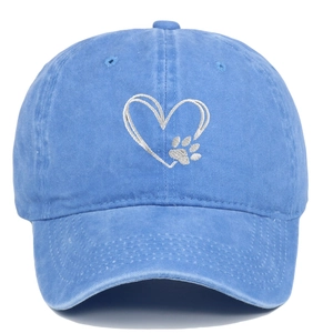 Close-up of heart and paw embroidery on light blue washed cotton baseball cap