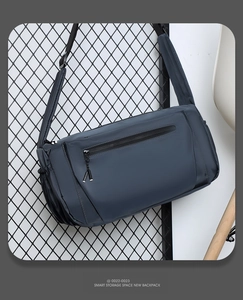 Close-up of waterproof dark blue sports bag with adjustable padded shoulder strap
