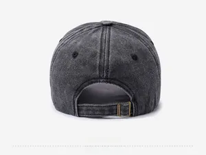Detail view of washed vintage baseball cap with adjustable antique brass metal buckle