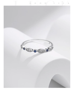 Close-up of S925 silver ring featuring blue gemstones and marquise-cut zircons
