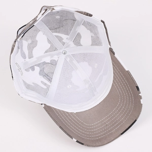 Detailed interior view of camouflage baseball cap showing polyester lining and sewing