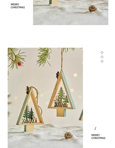 Detail of wooden Christmas tree ornaments with XMAS lettering and reindeer motifs