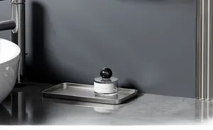 Macro view of brushed silver rectangle metal storage tray on marble surface