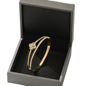 Rose gold clover open bangle with zircon stones in a premium jewelry gift box