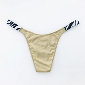 Detailed view of women's khaki cotton panties with black and white zebra pattern side straps