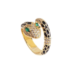 Golden snake ring with black enamel and zircons on a clean white background