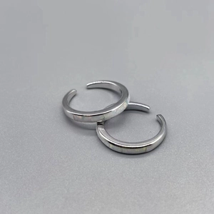Detail view of two S925 sterling silver open toe rings featuring iridescent opal stones