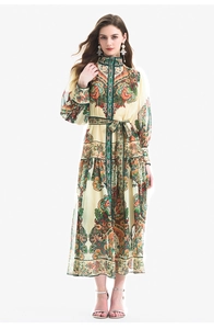 Detailed view of paisley print dress with bishop sleeves and matching fabric belt