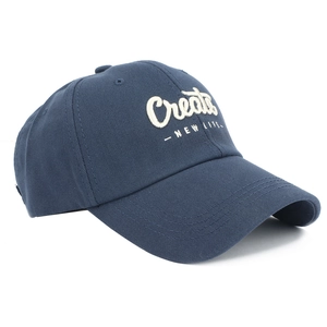 Detail view of navy baseball cap featuring white 3D Create New Life embroidery