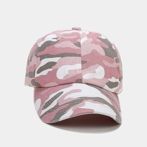 Detail of the pink camouflage pattern and fabric texture on a cotton baseball cap
