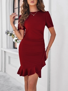 Detail of slim-fit dark red dress showing the elegant ruffled hem and professional stitching