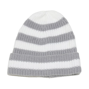 Detail of grey and white striped knit beanie showing thick ribbed texture and folded cuff