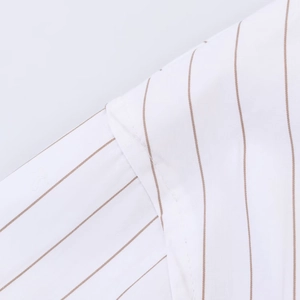 Macro detail of high-quality brown pinstripe poplin fabric with fine stitching quality