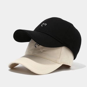 Minimalist heart embroidered baseball caps in black and beige for outdoor sun protection