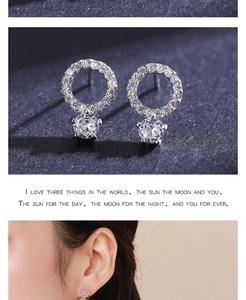 Detail of S925 sterling silver stud earrings with large round sparkling diamonds