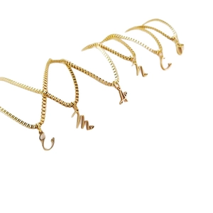 Elegant gold stainless steel initial pendant necklace with box chain for women.
