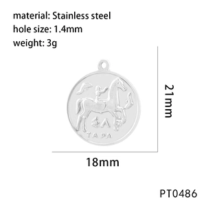 Macro shot of stainless steel pendant with embossed rider motif and 18mm size markers