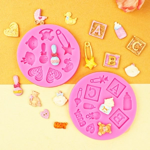Baby themed silicone mold for fondant and chocolate featuring blocks, bottles and teddy bears