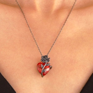Gothic black chain necklace with a red heart pendant and intricate black metal rose design
